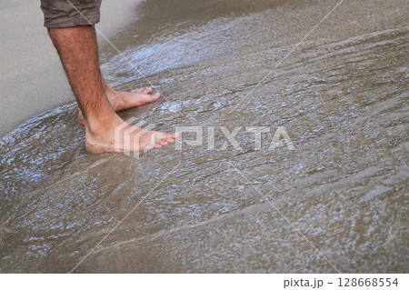 close up of bare feet on the beach close up of bare feet on the beach 128668554