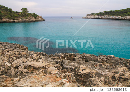 a beautiful ship is sailing in the blue sea 128668618