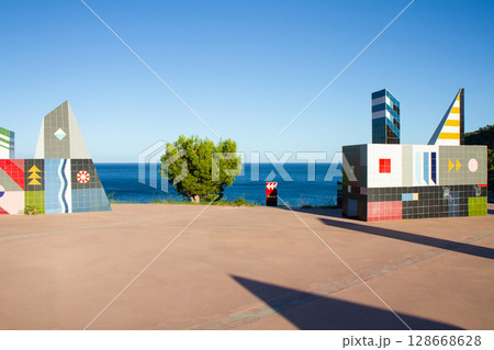 beautiful seascape with colorful geometric shapes on the shore beautiful seascape with colorful geometric shapes on the shore 128668628
