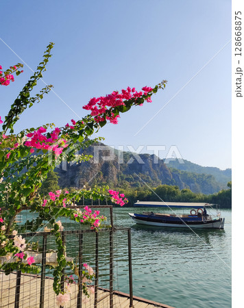 a beautiful ship is sailing in the blue sea 128668875