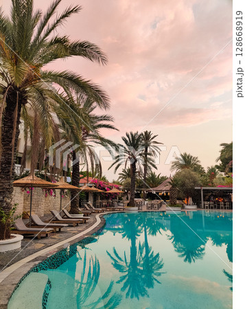 a beautiful large swimming pool near the house a beautiful large swimming pool near the house 128668919