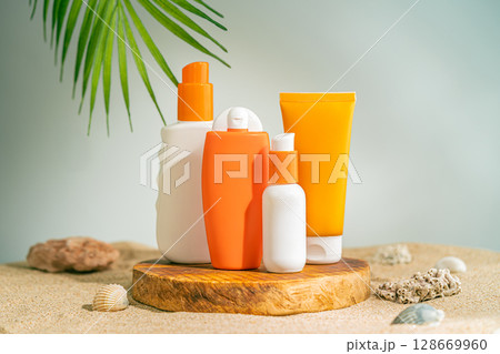 Sun care bottles on wood stand 128669960