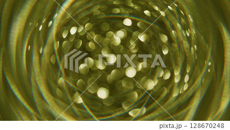 Glitter art. Bokeh circle. Defocused yellow golden colorful radiant lens flare kaleidoscope moving on abstract blurred art background. 128670248