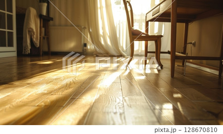 sunlit hardwood floor in bright room 128670810