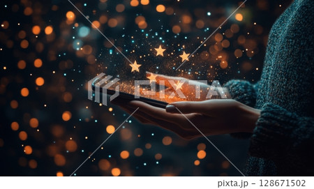 Mobile phone glowing with five stars. Mobile phone glowing with five stars. 128671502