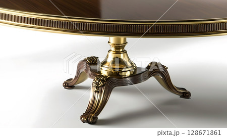 A gold and wood table with a gold base 128671861