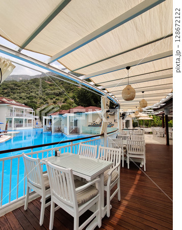 a beautiful large swimming pool near the house 128672122