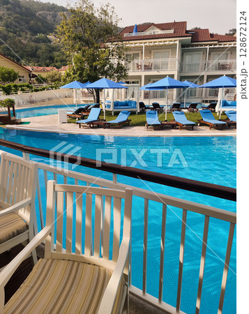 a beautiful large swimming pool near the house a beautiful large swimming pool near the house 128672124