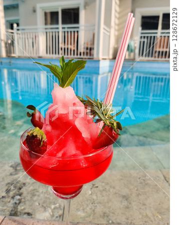 close up of a beautiful fruity alcoholic cocktail 128672129