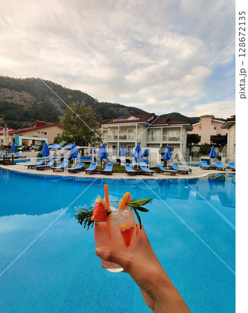 close up of a beautiful fruity alcoholic cocktail 128672135