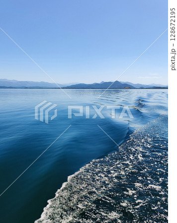 beautiful seascape on the horizon silhouette of mountains beautiful seascape on the horizon silhouette of mountains 128672195