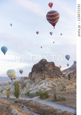 beautiful scenery flight of balloons in the mountains of Cappadocia in love valley 128672292