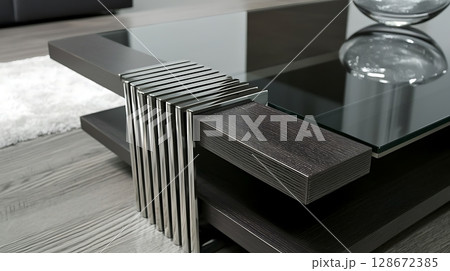 A glass coffee table with a black top and a silver frame A glass coffee table with a black top and a silver frame 128672385