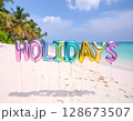 Iridescent Holidays Balloons on Tropical Beach 128673507