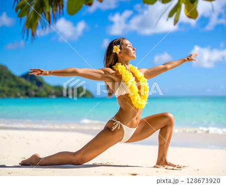 Beautiful Tahitian Woman Doing Yoga on Tropical Beach with Frangipani Flower Lei 128673920
