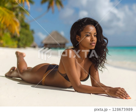 Beautiful Woman on Tropical Beach 128673989