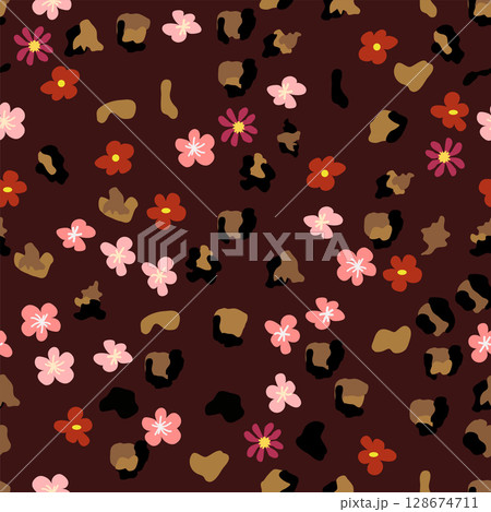 Leopard print with flowers and palm leaves. 128674711