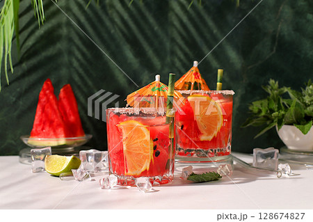 Mojito with lemon, mint, watermelon, ice with tequila, vodka or soda water on elegant background, minimalist concept for bar, soft drink for weight loss, advertising banner for cafe 128674827