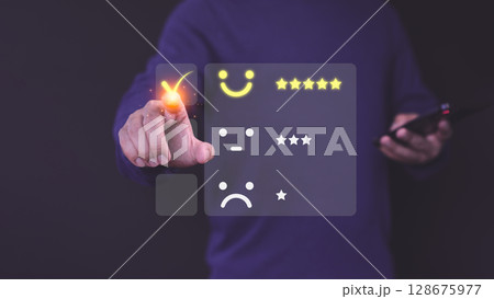 Man select a happy face icon on a feedback with neutral and sad face options below. Concept of customer satisfaction, testimonial, online reviews, decision-making in user experience evaluation. Man select a happy face icon on a feedback with neutral and sad face options below. Concept of customer satisfaction, testimonial, online reviews, decision-making in user experience evaluation. 128675977