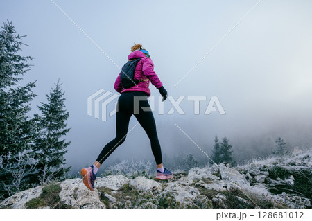Trail Runner in Misty Mountain Landscape 128681012