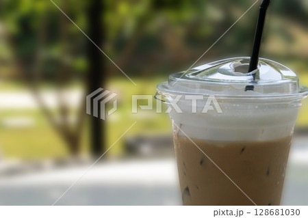 Ice coffee made refreshing but plastic cup may be a garbage. 128681030