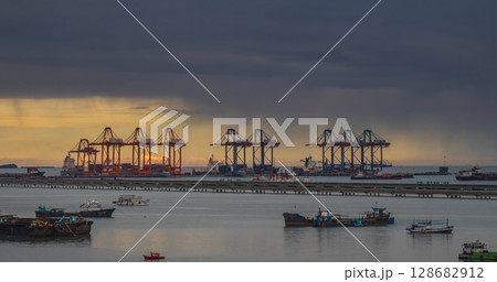 Logistic shipping quay boat Engineering crane depot at logistic export terminal control. Warehouse freight background container yard loading quayside harbor port. Logistics seascape shipping portal Logistic shipping quay boat Engineering crane depot at logistic export terminal control. Warehouse freight background container yard loading quayside harbor port. Logistics seascape shipping portal 128682912