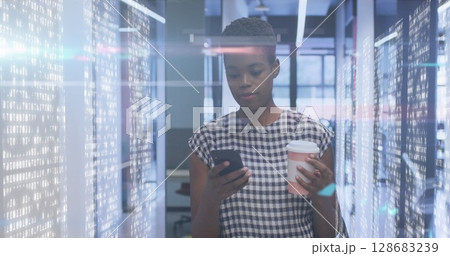 Image of lights over african american women in server room 128683239