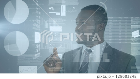 Statistical data processing against african american businessman touching an invisible screen Statistical data processing against african american businessman touching an invisible screen 128683248