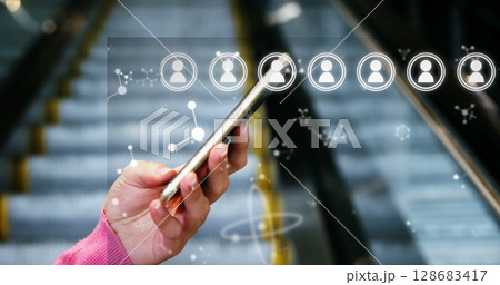 Image of media icons and shapes over biracial businesswoman using smartphone 128683417