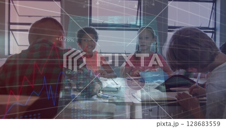 Screens with data processing against group of diverse students studying in a class at school Screens with data processing against group of diverse students studying in a class at school 128683559
