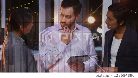 Image of financial graphs over diverse businesspeople talking in office Image of financial graphs over diverse businesspeople talking in office 128684896