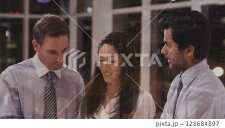 Image of financial graphs over diverse businesspeople talking in office 128684897