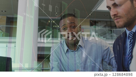 Image of financial graphs over diverse businesspeople talking in office Image of financial graphs over diverse businesspeople talking in office 128684898
