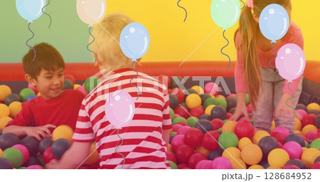 Image of falling balloons over happy diverse children having fun 128684952