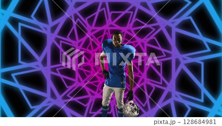 Image of african american male american football player with helmet over shapes 128684981