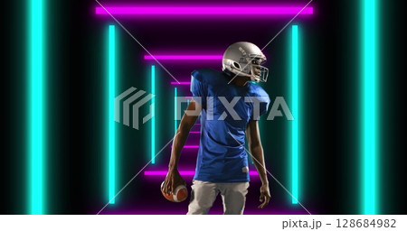 Image of african american male american football player with ball over shapes Image of african american male american football player with ball over shapes 128684982