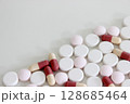 Drug tablet and capsule isolated on the white background 128685464