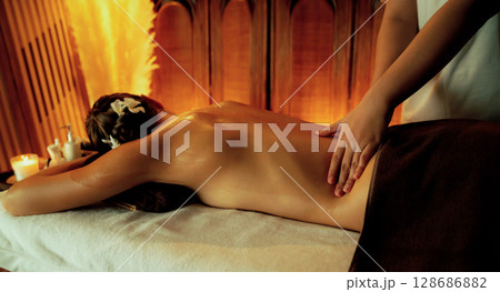 Caucasian woman customer enjoying relaxing anti-stress massage. Quiescent 128686882