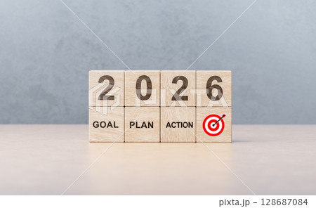 2026 new year business action plan. Wooden blocks with goal, plan, action and target words on wooden table background 128687084