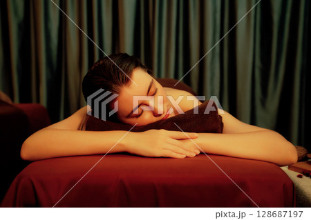 Caucasian woman customer enjoying relaxing anti-stress massage. Quiescent 128687197