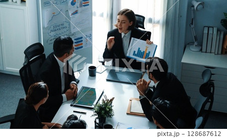 Top view of manager show increase sales chart while team clap hand. Directorate. 128687612