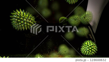 Image of virus cells and rugby ball with japan text on black background 128688632