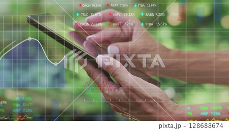 Image of data processing over caucasian woman using tablet 128688674
