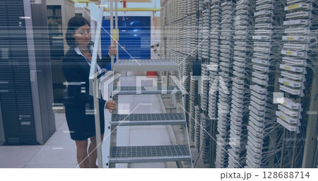 Image of glitch over caucasian woman checking servers 128688714