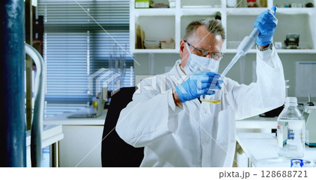 Image of chemical formulas over caucasian senior male lab worker with sample 128688721