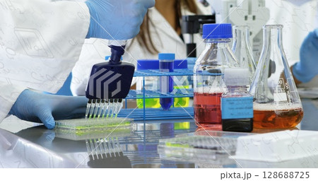 Image of chemical formulas over hands of caucasian male lab worker with samples 128688725