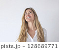Young happy beautiful woman with long blond hair with cute smile wearing white shirt.AI Generative. 128689771