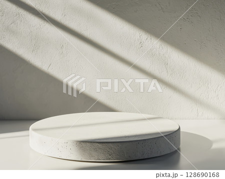 Smooth concrete texture illuminated by soft natural light on round platform 128690168