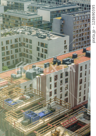 Modern apartment construction site with rooftop gardens. High quality photo 128690395