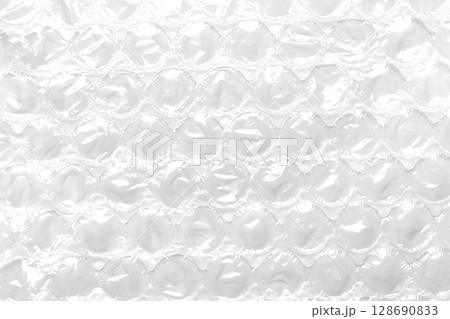 Packaging bubble wrap texture. Used protective soft material. White abstract background 128690833